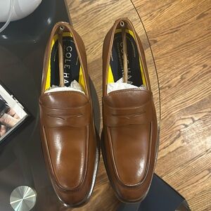 Never worn Cole Haan British tan classic loafers. Brand new condition.